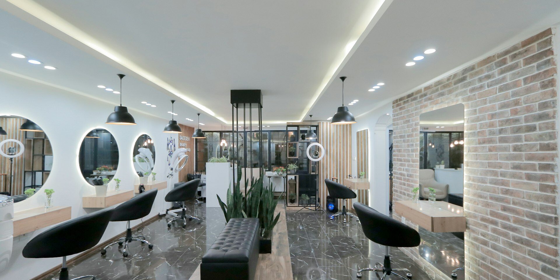 Modern luxury salon interior with styling stations