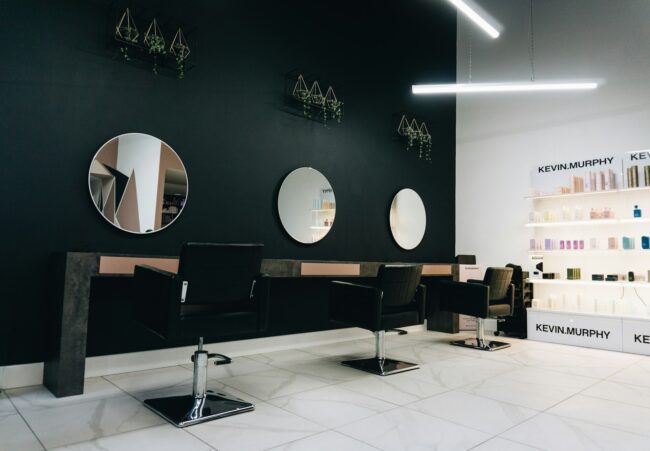 Clean modern salon suite interior with styling equipment